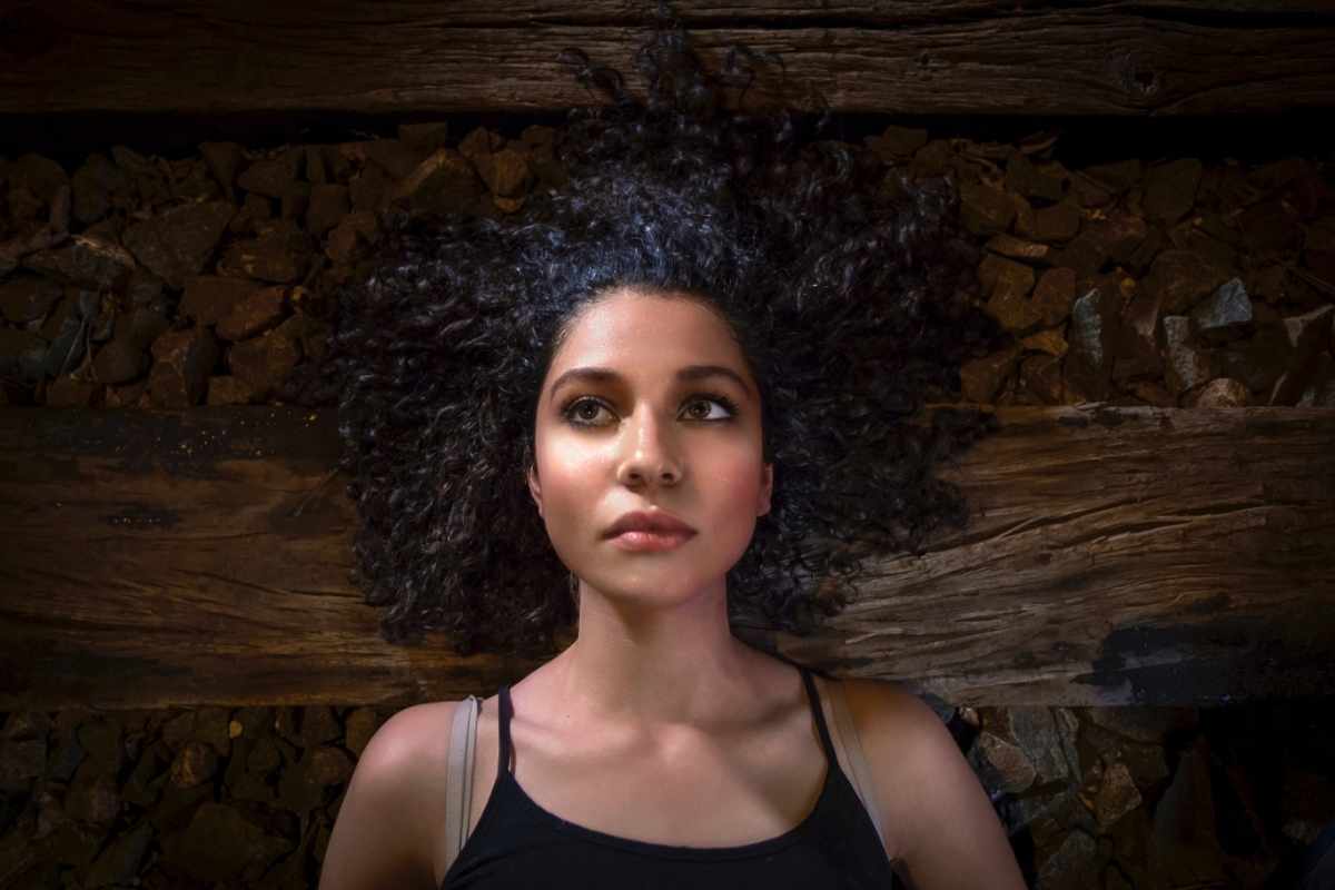 Woman lays on the floor. Sitting with uncomfortable feelings seeds empowerment: Bethany Webster